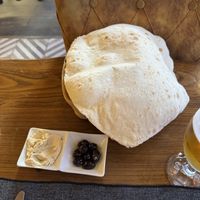 Freshly made bread with hummus and olives oil  at Constantine's Ark in Istanbul