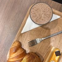 croissant, pain au chocolat, hot chocolate and a dessertt  at VG Pâtisserie in Paris