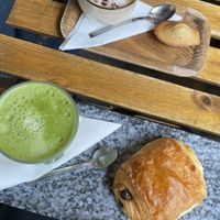 Cappuccino, madeleine, matcha latte & pain au chocolat   at VG Pâtisserie in Paris