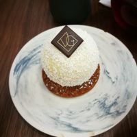 le pompon blanc- dessert from white chocolate, coconut and passionfruit at VG Pâtisserie in Paris