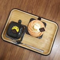 Poufsouffle (lemon and black sesame) and tartelette (orange and lemon with meringue) at VG Pâtisserie in Paris