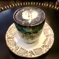 Charcoal oat latte  at Chapter One in Manchester