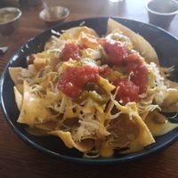 This was bigger than it looks. 'chorizo' cheese sauce, shredded cheese, salsa. Really tasty! at Esparza's Tacos & Coffee in Chatan