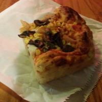 slice with pineapple, corn, and mushrooms at Riel's Vegan Pizza Slice in Glasgow