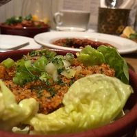 Kisir - Tomato and red pepper flavoured brown bulgur salad with fresh vegetables, lemon and olive oil - ca. 3 Euros at Dobrumba in Budapest