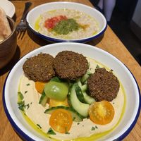 Felafel and hummus, strange aubergine dip behind   at Dobrumba in Budapest