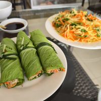 Mustard leaf rolls and papaya salad at Sesame in Hanoi