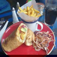 Vegan falafel and houmous wrap with added Avacado, fries and Vegan slaw   at Delfino Lounge in Poole