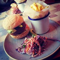 Vegan falafel burger with fries and Vegan slaw  at Delfino Lounge in Poole