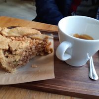Expresso and a big portion of Apfelstrudel at La Colectiva Cafe in Madrid