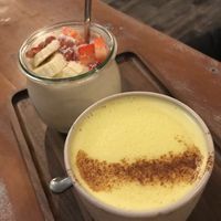 Turmeric latte and fruit yogurt at La Colectiva Cafe in Madrid