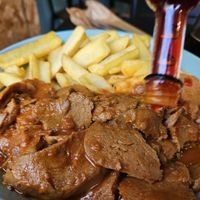 Seitan plate with french fries at Vegana By Tentúgal in Porto