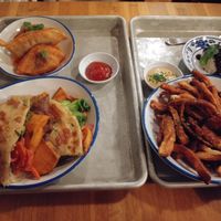 Vegan dumplings, sweet potato sandwich, fries, and sticky rice. at Mei Mei in Boston