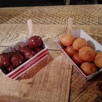 lukumades with dark chocolate and agave syrup at Lukumades in Athens