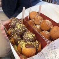 Bitter chocolate and pistachios and cinnamon and walnut on the other   at Lukumades in Athens