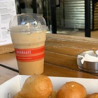 Lukumades with agave syrup & almond latte at Lukumades in Athens