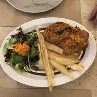 Fermented cabbage filled white rice and seitan. Yuca and salat.  at La Casa Viva in Tavernes De La Valldigna