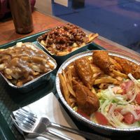Poutine régulière, Poutine Général Tao et Assiette de poulet portugais at Herbivores Marche Vegetalien in Montreal