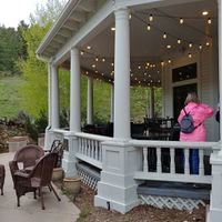 Outside seating near creek at Mama Rose in Estes Park