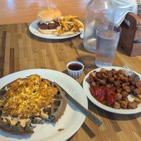 Mushroom waffle melt with a side of diced potatoes, and the hot Nashville sandwich at Off The Griddle - Southeast in Portland