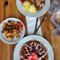 Berries waffles, pumpkin pie waffle, tofu scramble, vegan bacon, and hashbrowns at Off The Griddle - Southeast in Portland
