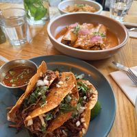 Birria tacos and enchiladas suiza   at Jajaja Mexicana - Lower East Side in New York City