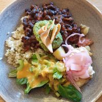 Blackbean+tomato hotpot, Kale pepito rice, Guacamole, Roast potato w/tofu mayo, Garden salad $16.50 at Friends of the Earth Cafe in Collingwood