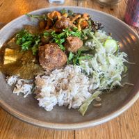 tofu curry, black bean sweet potato, sauerkraut, rice and cauliflower fritters at Friends of the Earth Cafe in Collingwood