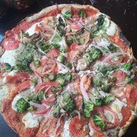 Pizza with tomato, aspergus, mushrooms and onions at NaturAle Cusco in Cusco