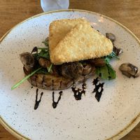 Sautéed mushrooms with spinach on toast and hash browns   at Monica's Cafe in Maleny