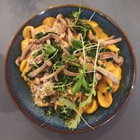 Creamy pumpkin pasta with asian mushrooms, miso sauce and parsley at Wilk Syty in Wroclaw