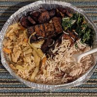 Medium combo with jerk tofu, greens, rice and peas, plantains at Ninth Square Market Caribbean Style in New Haven