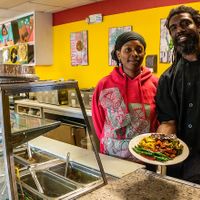 the hostess and chef with my meal at Ninth Square Market Caribbean Style in New Haven