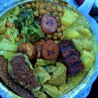 large plate:  3 proteins of jerk tofu, curry tofu, drumsticks; and 4 sides of curry garbanzos, curry potatoes, curry veg, and curry cabbage at Ninth Square Market Caribbean Style in New Haven