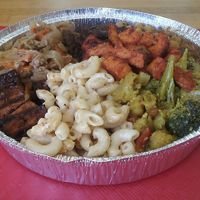Mac n' chz, curry cauliflower and broccoli, smoky sweet potatoes, curried chickpeas, jerk tofu, cabbage and chick'n, and seitan stew at Ninth Square Market Caribbean Style in New Haven
