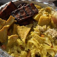 Jerk tofu, curried potatoes, seasoned rice, cabbage and curry tofu. at Ninth Square Market Caribbean Style in New Haven