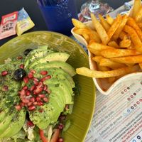 Avocado salad + fries (paprika on top)  at El Rincon de Beirut in Sevilla