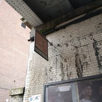 Outside sign under the bridge at Where The Pancakes Are in South East London