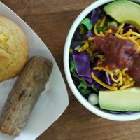 Vegan corn muffin, vegan grilled sausage, No Coast Bowl +optional avocado slices (non-vegan cheese for my partner) at The Full Bowl in Cedar Rapids