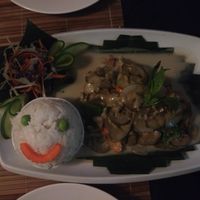 Fried aubergine in coconut with happy face rice! at Bamboo Tree Lao Cooking School and Restaurant in Luang Prabang
