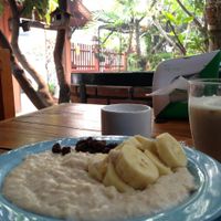 chai tea and not so great banana oatmeal with the beautiful garden in the background at Blue Diamond in Chiang Mai