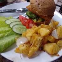 Tempeh burger with home fries. at Blue Diamond in Chiang Mai