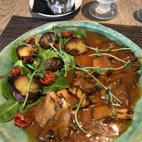 Sweet oyster mushrooms with bbq sauce and grilled potatoes on the salad  at Mandala in Belgrade