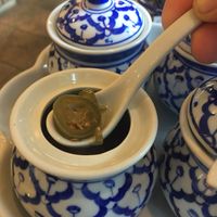 Spiced peppers in vinegar; comes in the hot sauce tray. A hint or spicey and vinegar. Not overpowering, and delicious!! at Sawasdee Thai Cuisine in Ventura