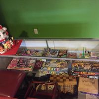 Board games and card games available to play. at Cafe Boba in Kentwood