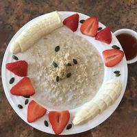Porridge with coconut agave and fresh fruit  at Eliane in Sunningdale