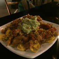 Green chili, beans, guacamole and banana chips at Fratello Vegan in Cuenca