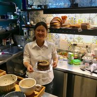 Sophie with her delicious chocolate cake at Blossom Rena Vegan Cafe 貝多蕾納 in Taipei