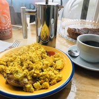 Scrambled Tofu on muffin...better size if you want a light bite 😋 at The Accidental Vegan Cafe in Honiton