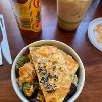 Iced latte with coconut milk & brekie bowl with quinoa and JUST EGG at Nourish Cafe in San Francisco